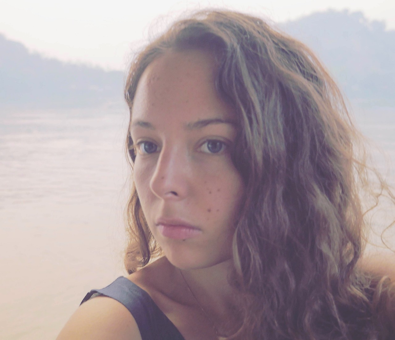 Close up of woman with wavy brown hair