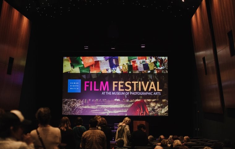 Photo of a movie screen that says HRW Film Festival