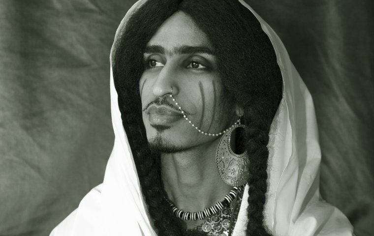 A black and white portrait of artist Ahmed Umar