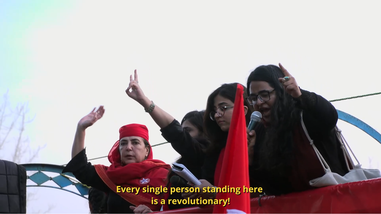 Women holding peace signs in the air 