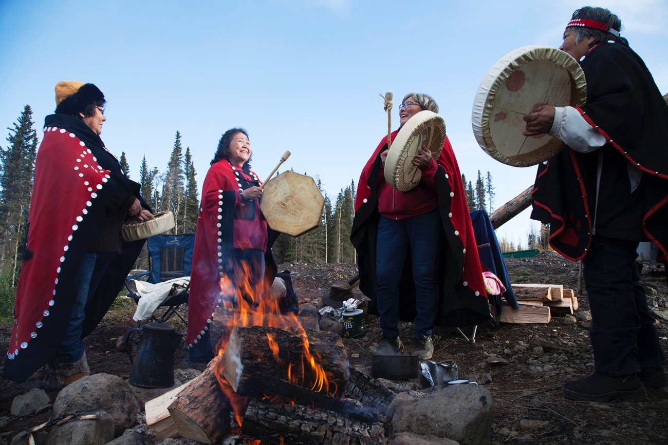 Film subjects Jenny Rita Bertha MarySinging around fire.