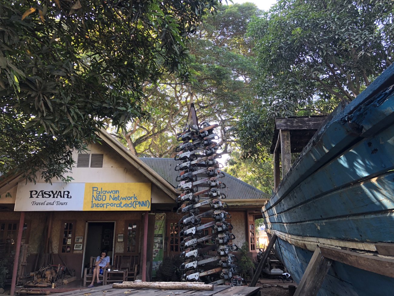 PNNI headquarters with chainsaw sculpture in front