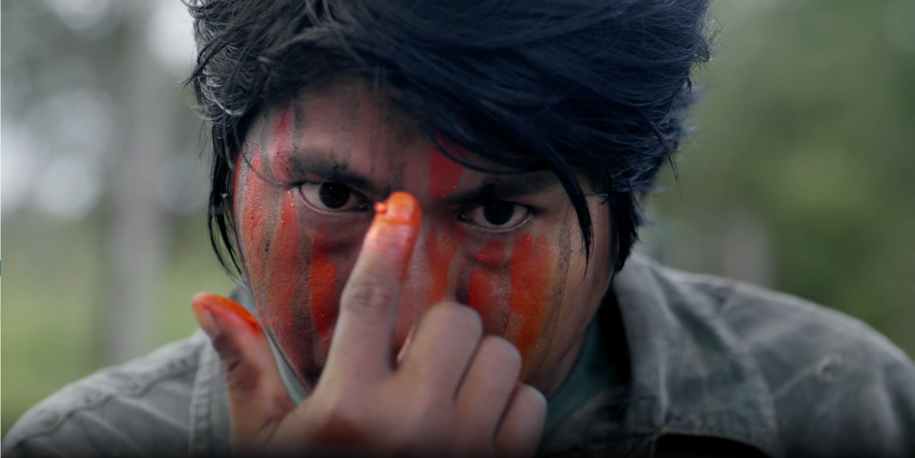 Marçal Guajajara paints his face, in preparation for a surveillance mission 