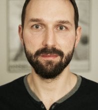 Headshot of white man with beard