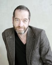 Image of white bam with beard wearing a blazer